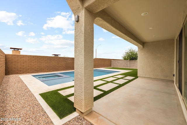 view of pool featuring an in-ground hot tub, a patio, and a fenced backyard
