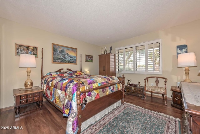 bedroom with wood finished floors, baseboards, and a textured ceiling