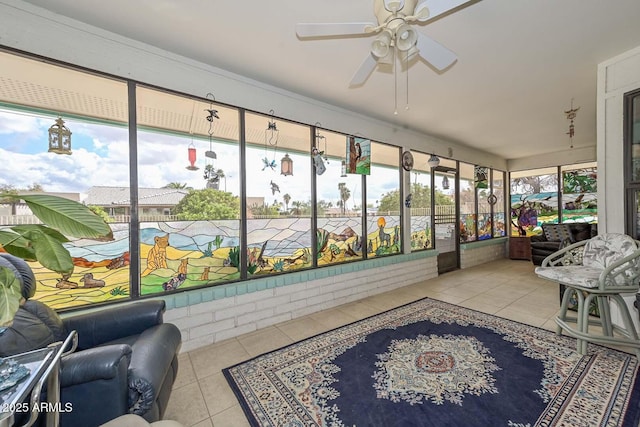 sunroom / solarium featuring a ceiling fan