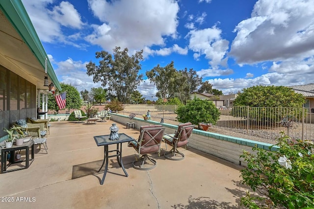 view of patio / terrace featuring fence