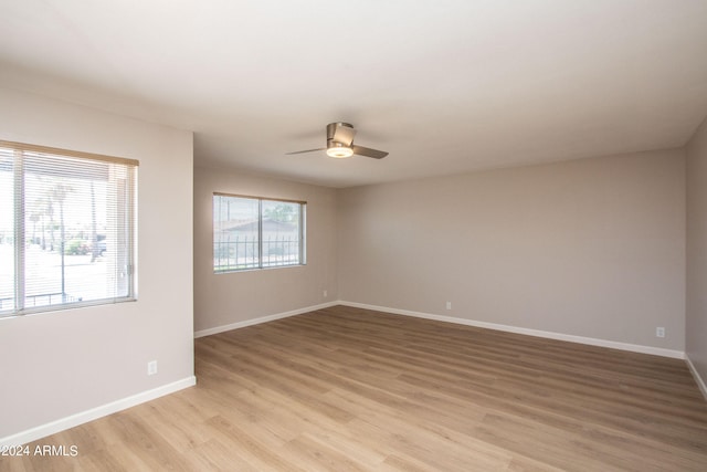 unfurnished room with ceiling fan and light hardwood / wood-style floors