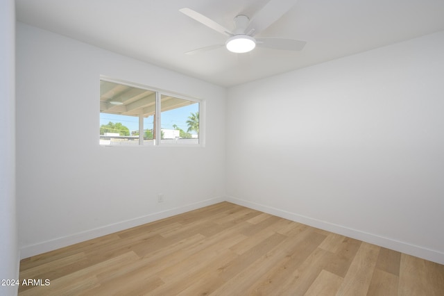 empty room featuring light hardwood / wood-style flooring and ceiling fan