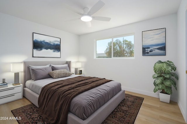 bedroom featuring ceiling fan and light hardwood / wood-style floors