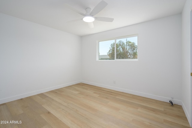 unfurnished room with ceiling fan and light hardwood / wood-style flooring