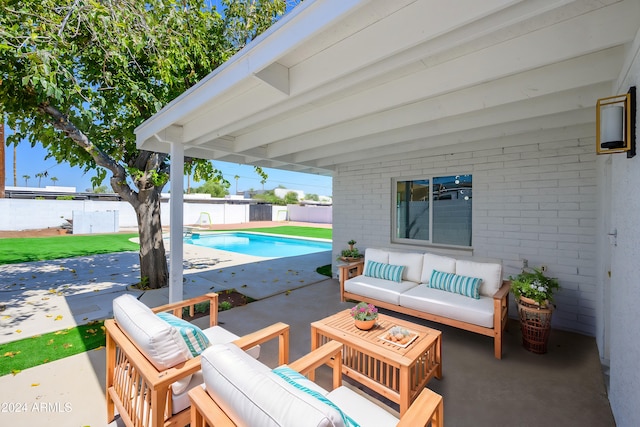 view of patio featuring an outdoor living space and a fenced in pool