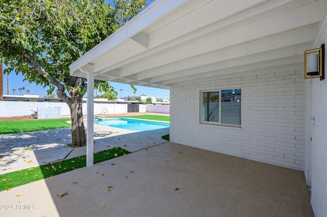 view of swimming pool with a patio