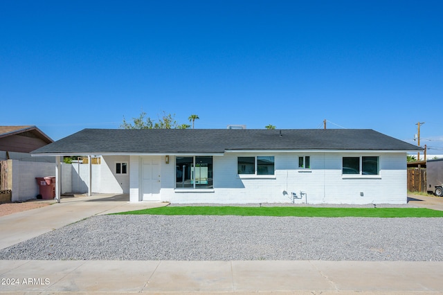 single story home with a carport