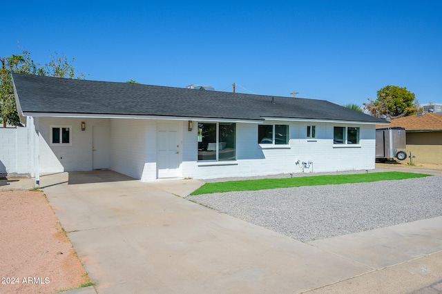 ranch-style house with a carport