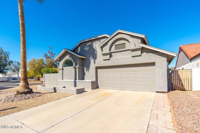 6524 W Beryl Ave, Glendale, AZ 85302 - view of front of property featuring a garage, driveway, stucco siding, and fence