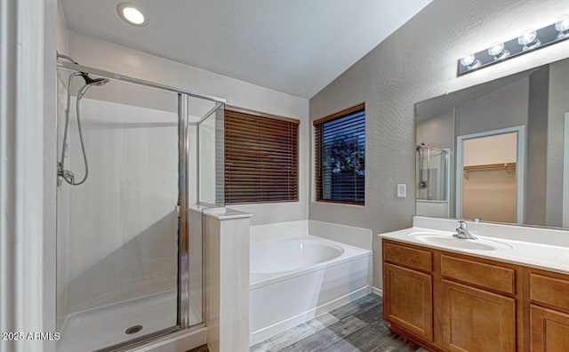 6920 S 46th Dr, Laveen, AZ 85339 - bathroom featuring a stall shower, a bath, vanity, a textured wall, and wood finished floors