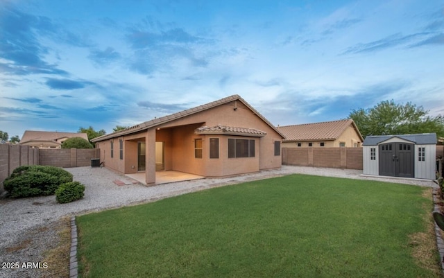 6920 S 46th Dr, Laveen, AZ 85339 - back of property with a patio area, stucco siding, and a tiled roof