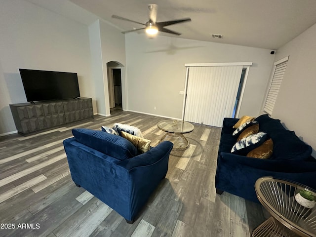 6920 S 46th Dr, Laveen, AZ 85339 - living room with vaulted ceiling, arched walkways, a ceiling fan, wood finished floors, and baseboards