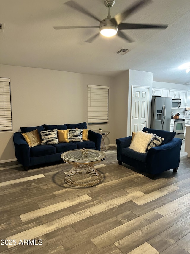 6920 S 46th Dr, Laveen, AZ 85339 - living room featuring ceiling fan, hardwood / wood-style floors, and baseboards