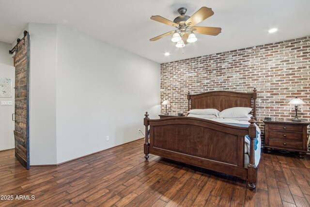 21131 E Excelsior Ave, Queen Creek, AZ 85142 - bedroom with hardwood / wood-style flooring, brick wall, ceiling fan, and recessed lighting