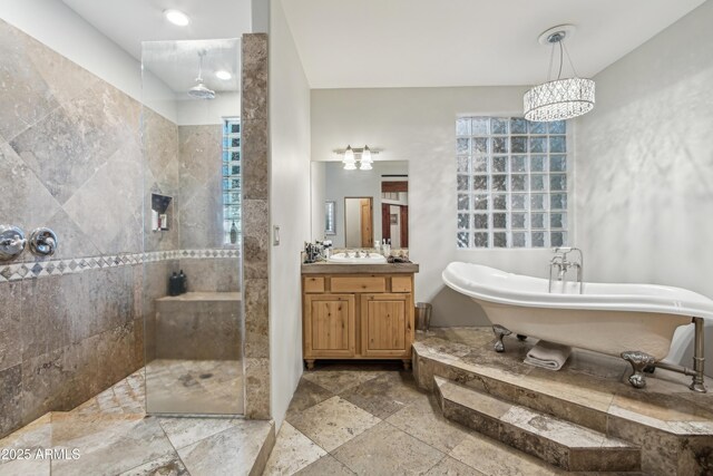 21131 E Excelsior Ave, Queen Creek, AZ 85142 - full bath with a tile shower, a freestanding tub, vanity, and a chandelier