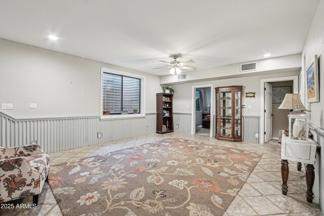 21131 E Excelsior Ave, Queen Creek, AZ 85142 - living area featuring a ceiling fan, wainscoting, and recessed lighting