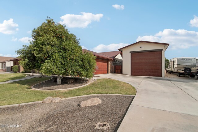 21131 E Excelsior Ave, Queen Creek, AZ 85142 - view of front of home featuring driveway, a front lawn, and a detached garage