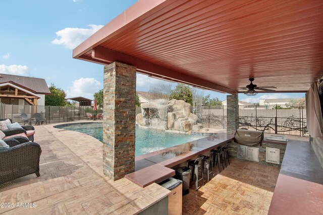 21131 E Excelsior Ave, Queen Creek, AZ 85142 - view of patio featuring a bar, exterior kitchen, and a ceiling fan