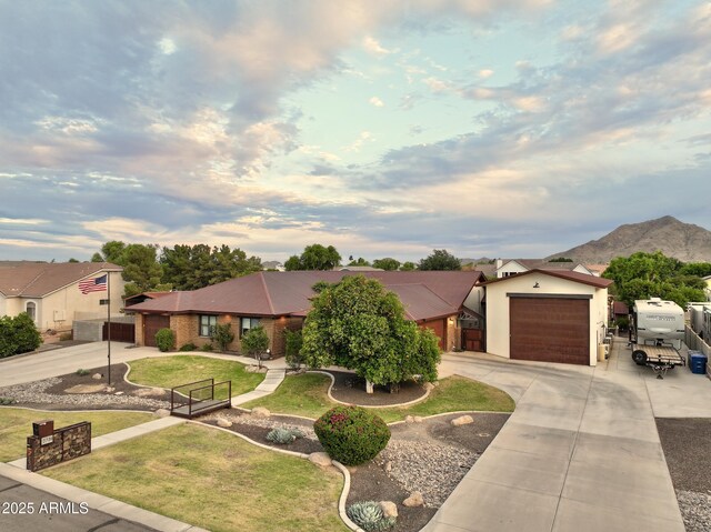 21131 E Excelsior Ave, Queen Creek, AZ 85142 - view of front of property with driveway, an attached garage, and a mountain view