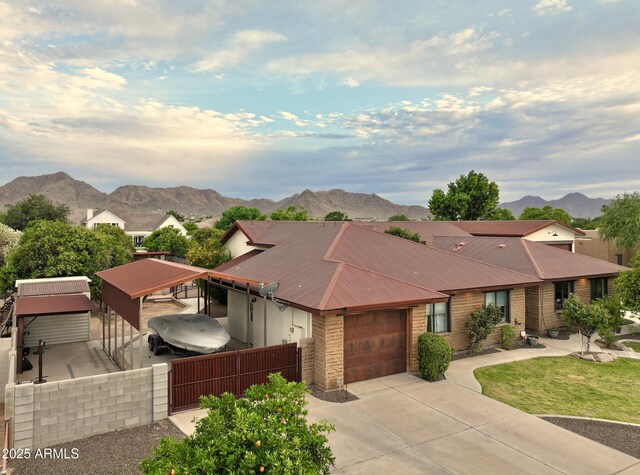 21131 E Excelsior Ave, Queen Creek, AZ 85142 - view of front of property featuring a mountain view, a garage, concrete driveway, and brick siding
