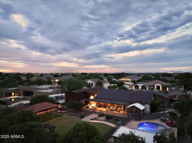 21131 E Excelsior Ave, Queen Creek, AZ 85142 - aerial view at dusk of a residential view and view of pool
