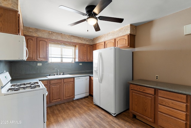 841 W Spray St, Superior, AZ 85173 - kitchen with white appliances, a sink, wood finished floors, decorative backsplash, and a ceiling fan