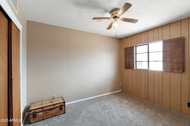 841 W Spray St, Superior, AZ 85173 - unfurnished bedroom with carpet flooring, a closet, a textured ceiling, baseboards, and a ceiling fan
