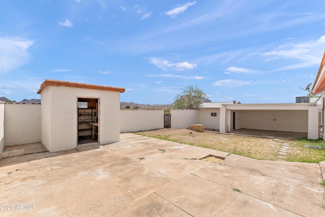 841 W Spray St, Superior, AZ 85173 - view of patio featuring cooling unit, an outbuilding, and a gate