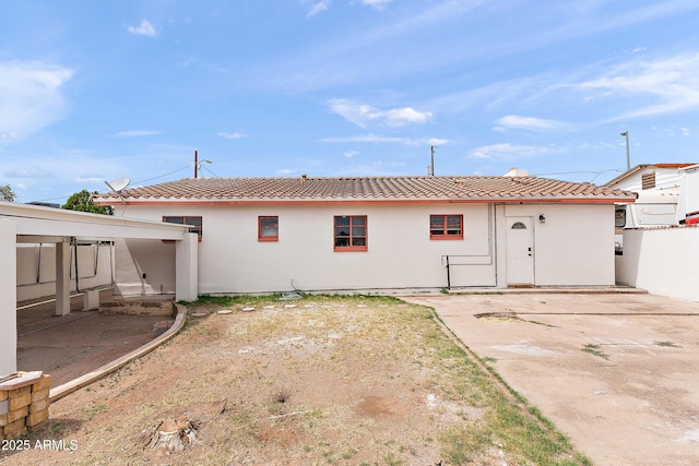 841 W Spray St, Superior, AZ 85173 - rear view of house with a tile roof, stucco siding, and a patio area