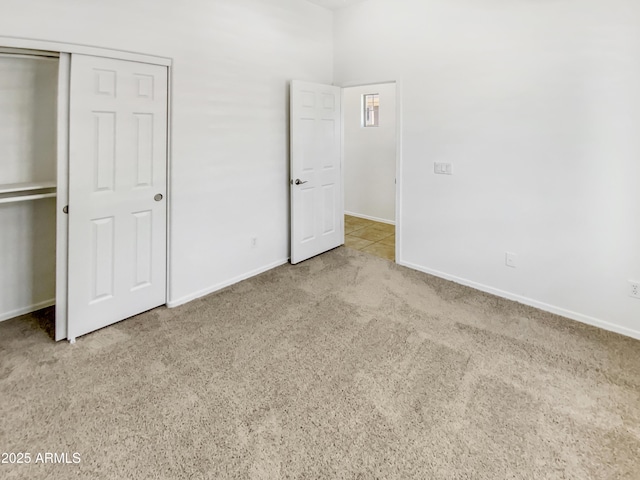 18207 W Marshall Ln, Surprise, AZ 85388 - unfurnished bedroom with baseboards, carpet, and a closet