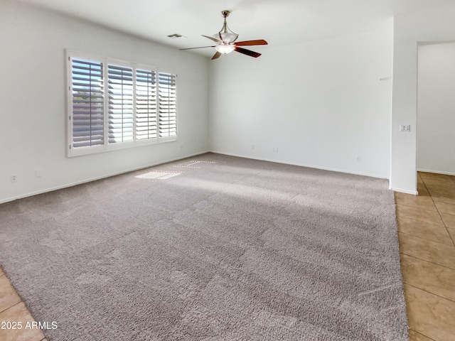 18207 W Marshall Ln, Surprise, AZ 85388 - tiled empty room with baseboards, ceiling fan, and visible vents
