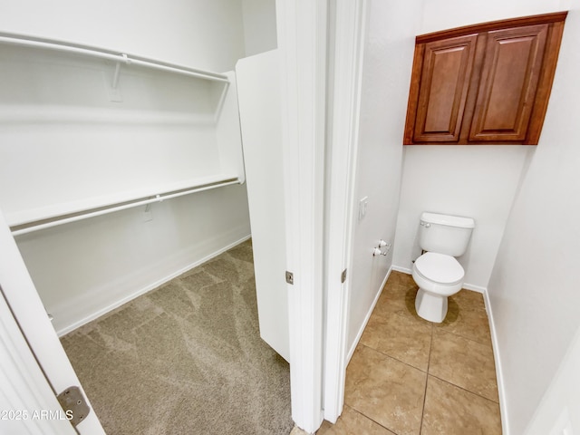 18207 W Marshall Ln, Surprise, AZ 85388 - bathroom featuring baseboards, tile patterned flooring, and toilet