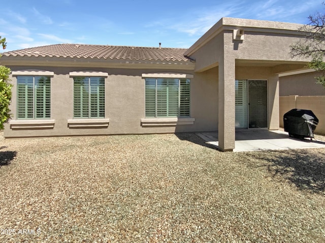 18207 W Marshall Ln, Surprise, AZ 85388 - back of house featuring a patio and stucco siding