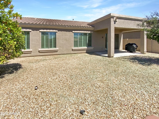 18207 W Marshall Ln, Surprise, AZ 85388 - rear view of property featuring a patio, stucco siding, and fence