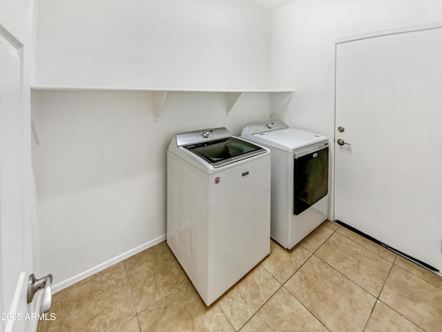 18207 W Marshall Ln, Surprise, AZ 85388 - clothes washing area with laundry area, baseboards, light tile patterned flooring, and separate washer and dryer