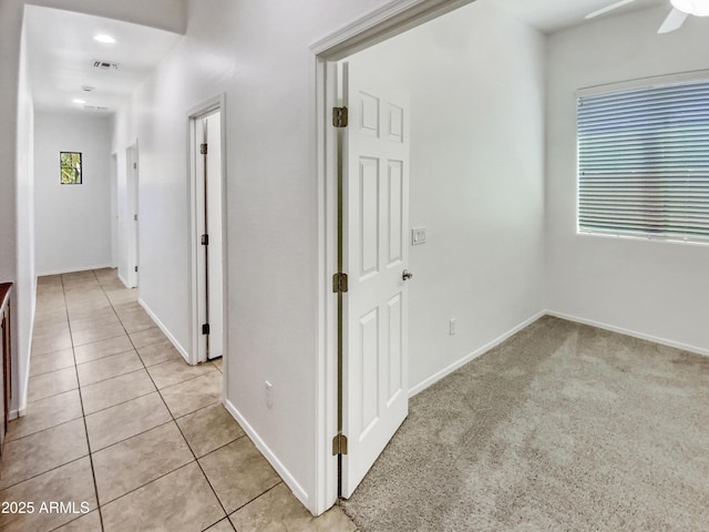 18207 W Marshall Ln, Surprise, AZ 85388 - corridor with baseboards, light tile patterned flooring, and visible vents