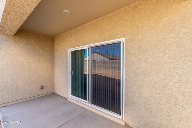 doorway to property featuring a patio area