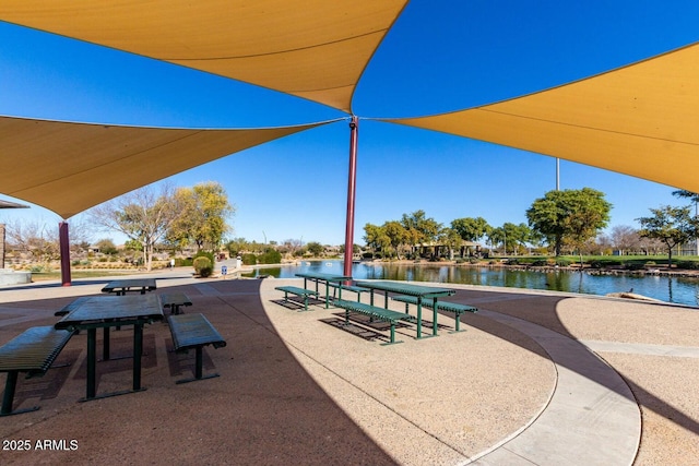 surrounding community featuring a water view