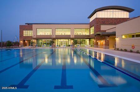 view of pool at dusk