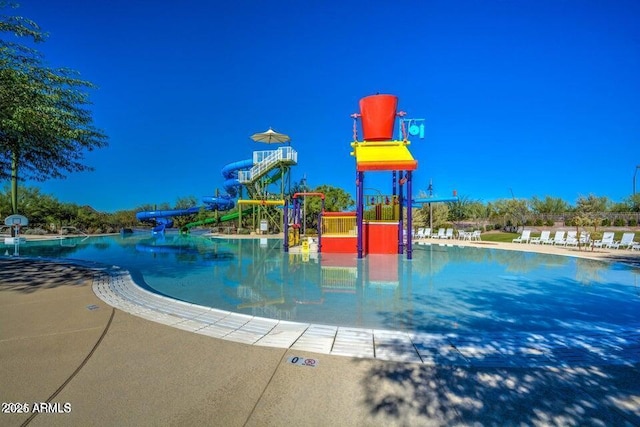 view of pool featuring a playground