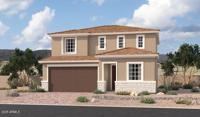 view of front of property featuring stone siding, stucco siding, driveway, and an attached garage