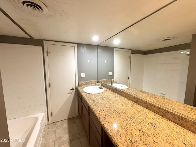 1702 W Tuckey Ln Unit 209, Phoenix, AZ 85015 - bathroom featuring double vanity, a bath, and tile patterned flooring