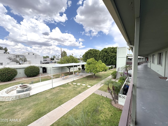 1702 W Tuckey Ln Unit 209, Phoenix, AZ 85015 - surrounding community with a fire pit, a yard, and a patio area