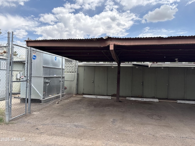 1702 W Tuckey Ln Unit 209, Phoenix, AZ 85015 - covered parking lot featuring a gate and fence