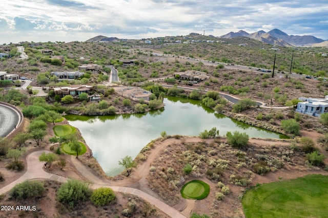 drone / aerial view featuring a water and mountain view