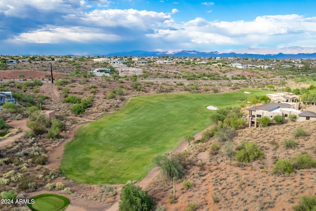 birds eye view of property featuring golf course view and a mountain view