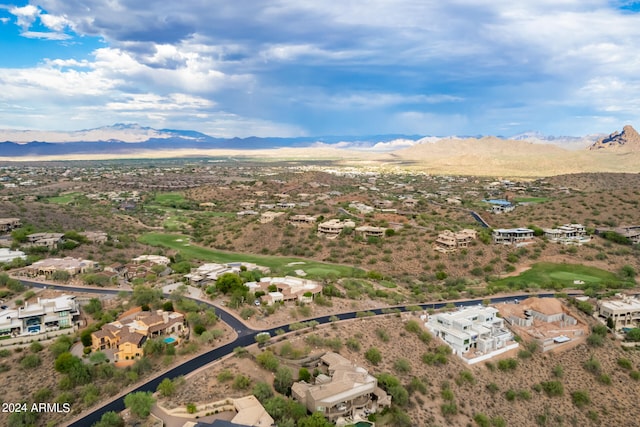 birds eye view of property with a mountain view