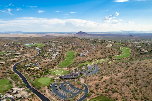 aerial view featuring a mountain view and golf course view