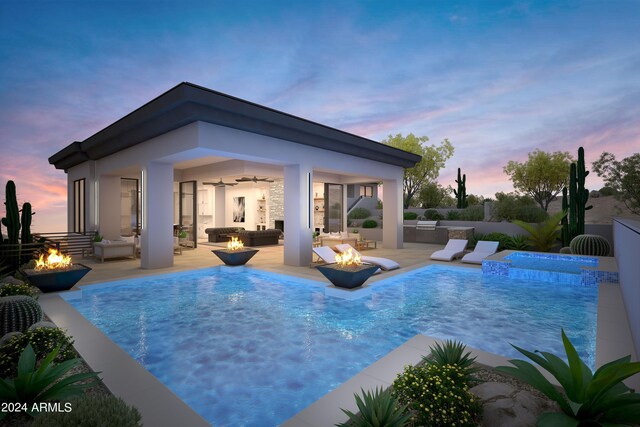 pool at dusk with a patio, an outdoor living space with a fire pit, and ceiling fan