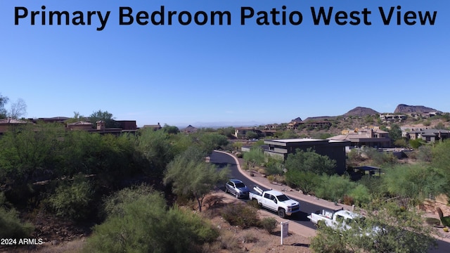 birds eye view of property featuring a mountain view